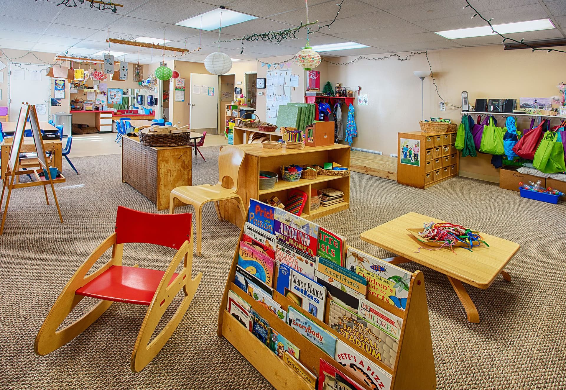 A teacher with toddlers at Blue Skies Exploration Academy